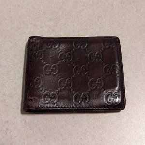 Gucci embossed leather bi-fold wallet